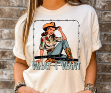 Load image into Gallery viewer, Person wearing a white t-shirt with a graphic design of a woman in a cowboy hat and boots, surrounded by barbed wire, with text 'What I Want'.