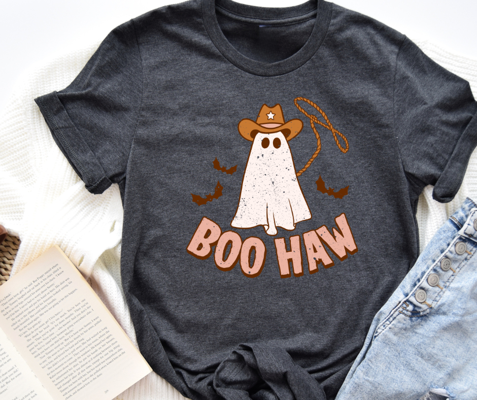 Dark gray t-shirt with a ghost wearing a cowboy hat and 'BOO HAW' text on a white surface.